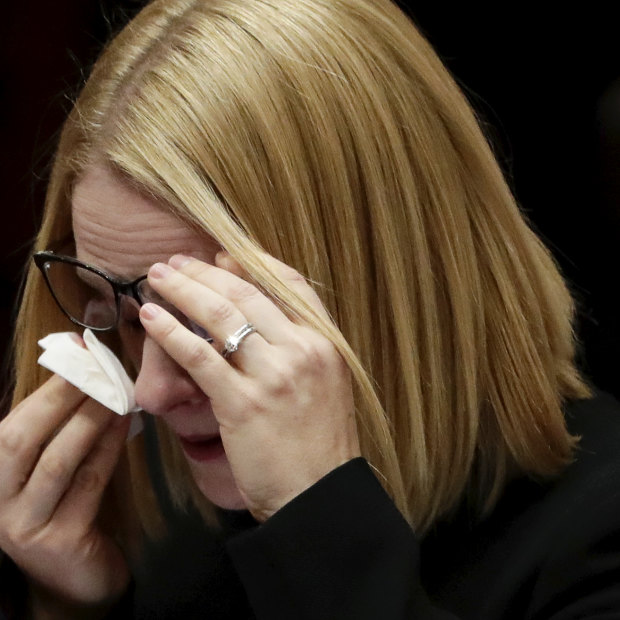 Amanda Stoker, who replaced George Brandis in the Senate, wipes away tears as she delivers her first speech.
