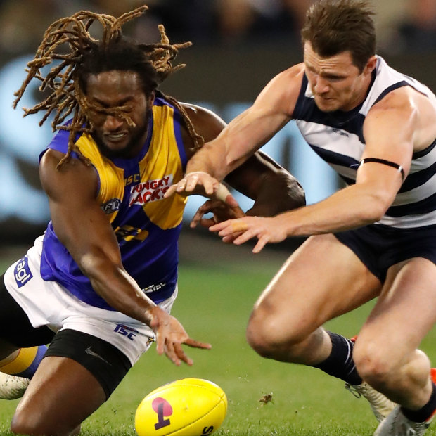 Nic Naitanui, left, shown here with Patrick Dangerfield, plays only 70 per cent of game time due to injury. Interchange reductions will force West Coast to rethink how they use their star ruckman.