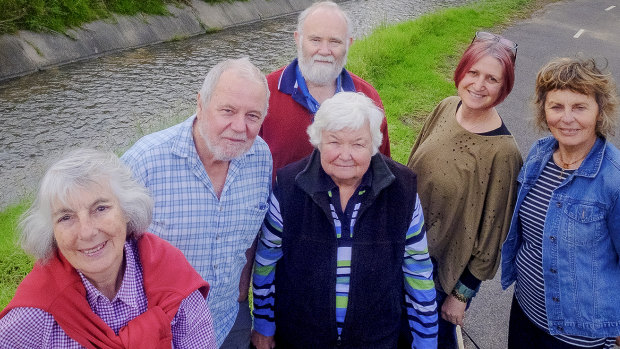 Kaye Oddie (left) and other members of Friends of Moonee Ponds Creek at Brosnan Crescent in Strathmore.