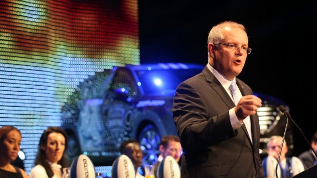 Prime Minister Scott Morrison speaks at the North Melbourne AFL breakfast on Saturday. 