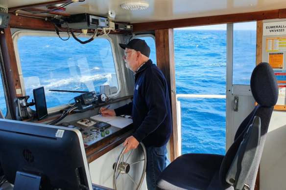 Garry Kerr at the wheel of his boat Eumeralla.
