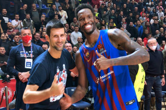 Djokovic poses with Barcelona basketballer Nigel Hayes-Davis on December 15 in Belgrade. 