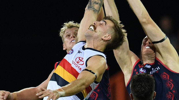 Man of the mo' Jordan Gallucci of the Crows jumps for the ball.
