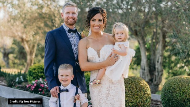 Tim Smith and Kym on their wedding day with children Hudson and Willow. 