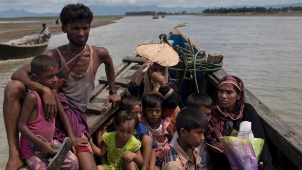 Newly arrived Rohingya Muslims from Myanmar travel in a boat to a camp for refugees in Shahparirdwip, Bangladesh, in 2017.
