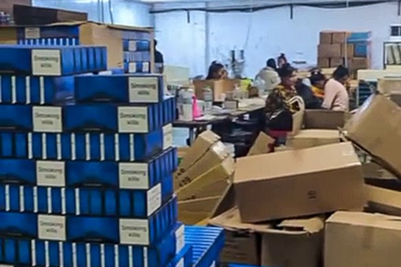 A police raid at a Cambodian cigarette counterfeiting plant.