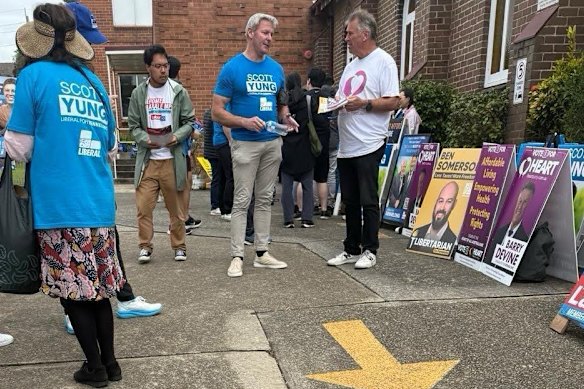 Gareth Hales, multimillionaire son of Plymouth Brethren Christian Church leader Bruce Hales, wears a blue Scott Yung campaign shirt at the Bennelong polling booth on April 30.