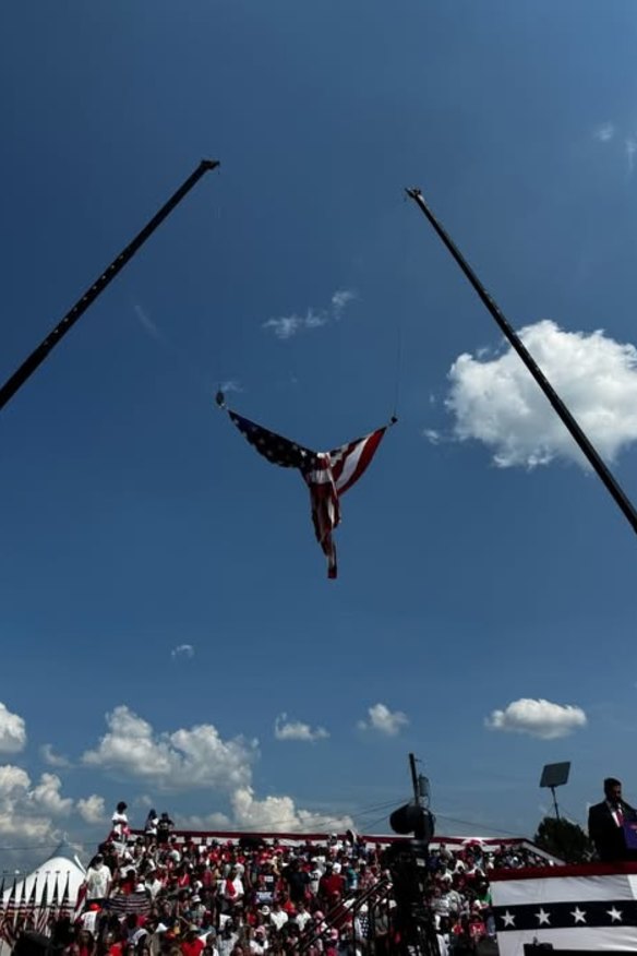 Image posted to the Facebook on July 16, 2024, with the caption: “This was the flag that was flying during President Trump’s rally before he spoke. If you take a closer look, you’ll see that it’s not the effort of man, this is the effort of nature...”  