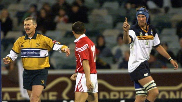 Wallabies second-rower Justin Harrison gestures to British and Irish Lions back Austin Healey during a match in 2001. 