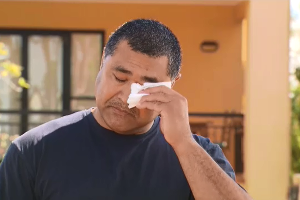 Toutai Kefu wipes away tears outside his Coorparoo home in Brisbane, following his return home from hospital where he was treated for injuries sustained during a violent home invasion.