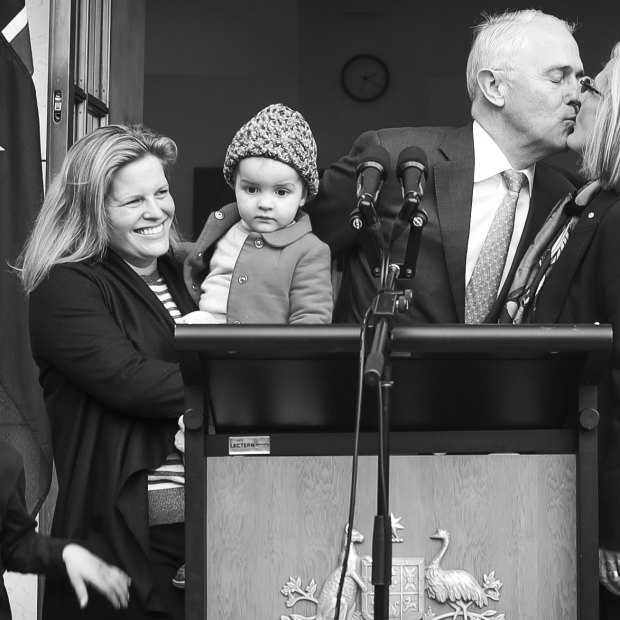 Malcolm Turnbull kisses his wife Lucy as daughter Daisy and grandchildren Jack and Alice stand by. 