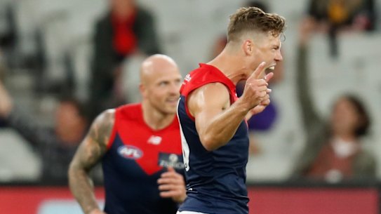 MELBOURNE, AUSTRALIA - APRIL 18: Jake Melksham of the Demons celebrates a goal during the 2021 AFL Round 05 match between the Hawthorn Hawks and the Melbourne Demons at the Melbourne Cricket Ground on April 18, 2021 in Melbourne, Australia. (Photo by Michael Willson/AFL Photos via Getty Images)
