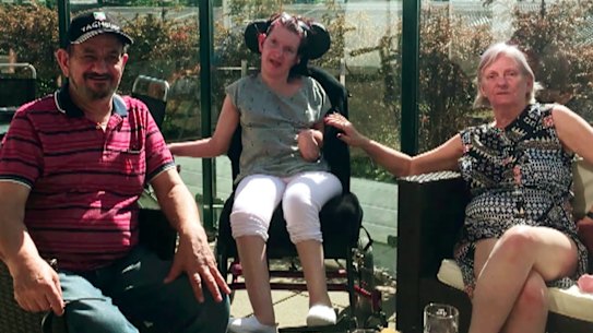 A 60 Minutes investigation has obtained footage of physical and emotional abuse meted out at a Scope residential home to client Lee-Anne Mackey (pictured here with her parents, Rob and Lorraine Mackey) who has cerebral palsy, uses a wheelchair, is non-verbal and has osteoporosis.