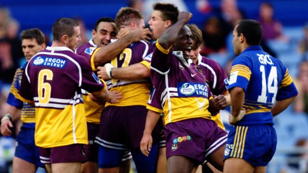 Thorn embraced by his teammates after scoring a try in the 2000 NRL preliminary final against the Eels. 