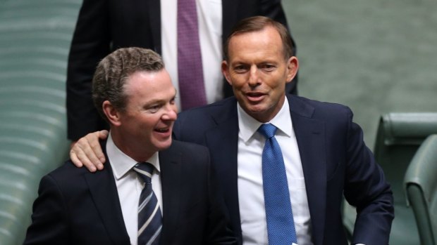 Winners are grinners: Christopher Pyne with Tony Abbott at the end of 2014.
