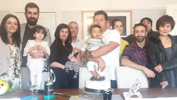 The extended Issa family, including Eddy Issa in the black in the back row, on March 22, the same day Victorian Premier Daniel Andrews announced he would shut down all non-essential activity across the state.