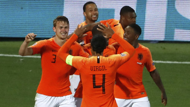 Matthijs de Ligt celebrates after scoring a goal.