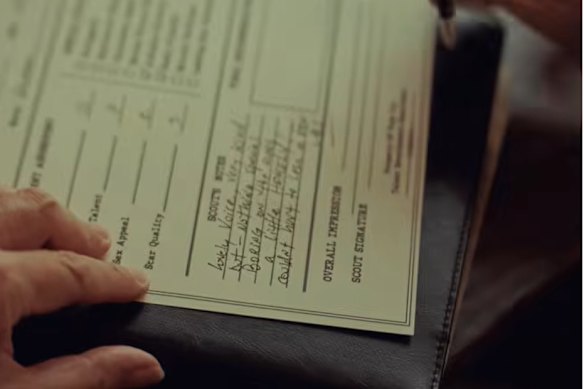 A screenshot of Ariana Grande’s Petal music video, where a casting director character notes it “couldn’t hurt to lose a little” about Grande’s audition.