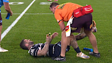 Adam Reynolds has his hamstring attended to.