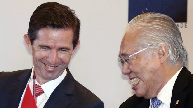 Australian Trade Minister Simon Birmingham, left, and Indonesian Trade Minister Enggartiasto Lukita at the  signing ceremony in Jakarta, Indonesia, on Monday.