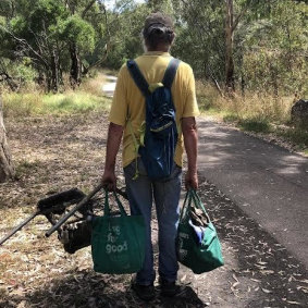 Bruce Lavender with the rubbish collected in bags.