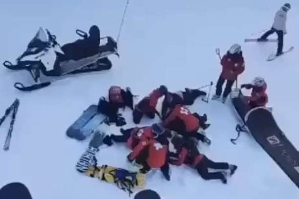 Ski patrol attends to the injured snowboarders after their chair fell last year.