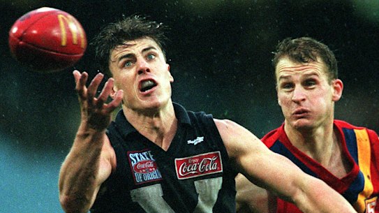 Pride of the jumper: Matthew Lloyd juggles a mark in 1999.