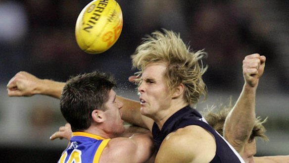 Courage: David Teague spoils Lions champion Jonathan Brown in 2005.