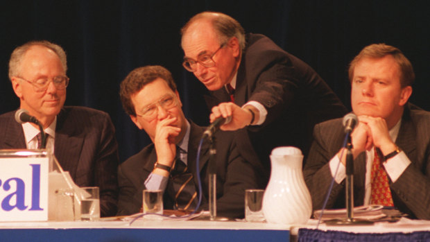Confusion: Tony Staley (far left) with then Liberal leader Alexander Downer, John Howard with his hand over the microphone and Peter Costello at the 1994 Liberal conference in Albury.