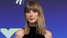Taylor Swift wore a sparkling Tamara Ralph gown for the occasion. 