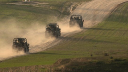 Israeli military vehicles move towards the Gaza Strip on January in the Southern Border, Israel.