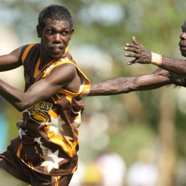 Action from the 2013 grand final between the Imau Tigers and Tapalinga Superstars on Bathurst Island, north of Darwin.