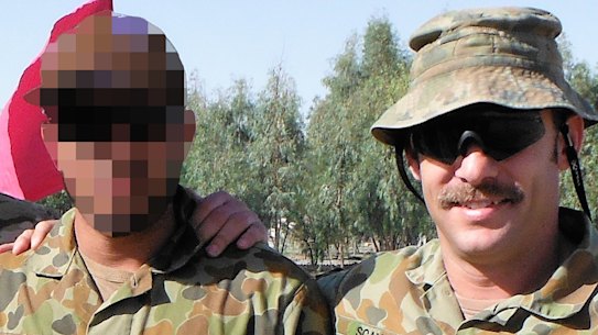 Captain Jason Scanes (right) in Afghanistan with Hassan.
