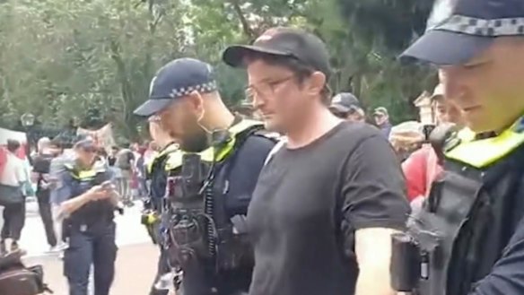 Liam Parry during his arrest outside Parliament House in Brisbane.