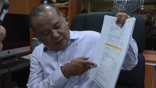 David Fifita's Bali lawyer Muhammad Rifan with a payslip showing the $30,000 payment.