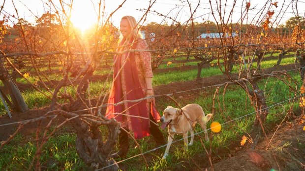 Vanya Cullen with her dog Solstice walking through one of the certified biodynamic vineyards at her organic winery Cullen Wines in Wilyabrup, Margaret River.
