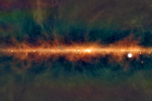 A view of the Milky Way from the Murchison Widefield Array, with the lowest frequencies in red, middle frequencies in green, and the highest frequencies in blue. The star icon shows the position of the mysterious repeating transient.