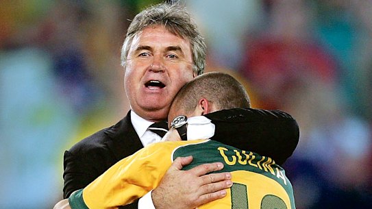 Guus Hiddink and Tim Cahill celebrate the Socceroos' drought-breaking qualification for the 2006 World Cup.