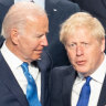 UK Prime Minister Boris Johnson stands with US President Joe Biden and other world leaders at the NATO summit.