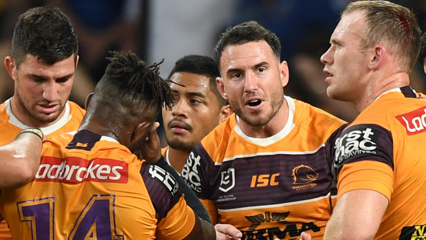 Skipper Darius Boyd speaks with teammates during the Broncos' horror loss to Parramatta in the finals.