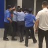 Guards try to shut customers in the Shanghai IKEA after it was placed on lockdown.