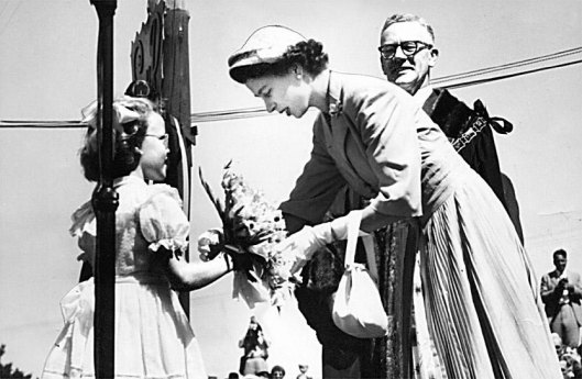 Queen Elizabeth accepting a posy from Elizabeth Redman during her visit to Shepparton in 1954.