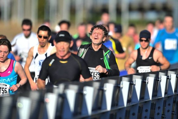 Competitors in the Melbourne Marathon head towards the MCG finish line.