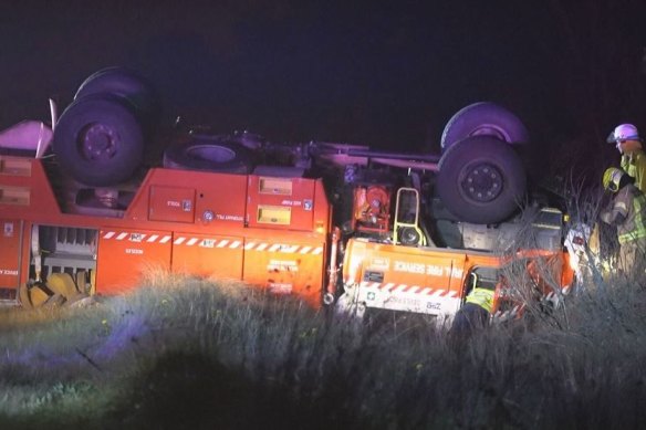 Four firefighters have been released from hospital after their fire truck rolled over early this morning while fighting blazes near the NSW-Queensland border.