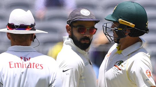 Heated: Australia and India's captains engage in some on-field niceties. 