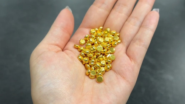 Chinese youth flock to viral gold beans amid economic uncertainty