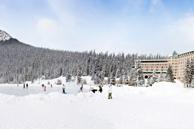  Ice skating on Lake Louise in front of the Fairmont Chateau resort hotel