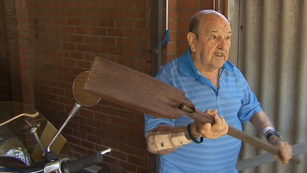 Orelia grandfather Peppe shows how he used a rusty shovel to defend himself from his neighbour.
