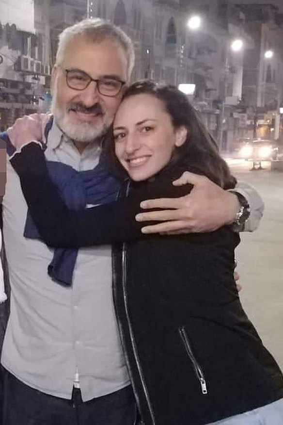 Hazem Hamouda with his daughter Saja when he was released from police custody.