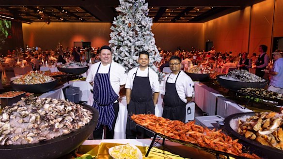Chefs pose with the bounteous offerings of The Star Brisbane’s Christmas Day Buffet.